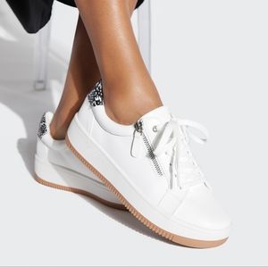 White flat sneaker with side zipper and snakeskin detail